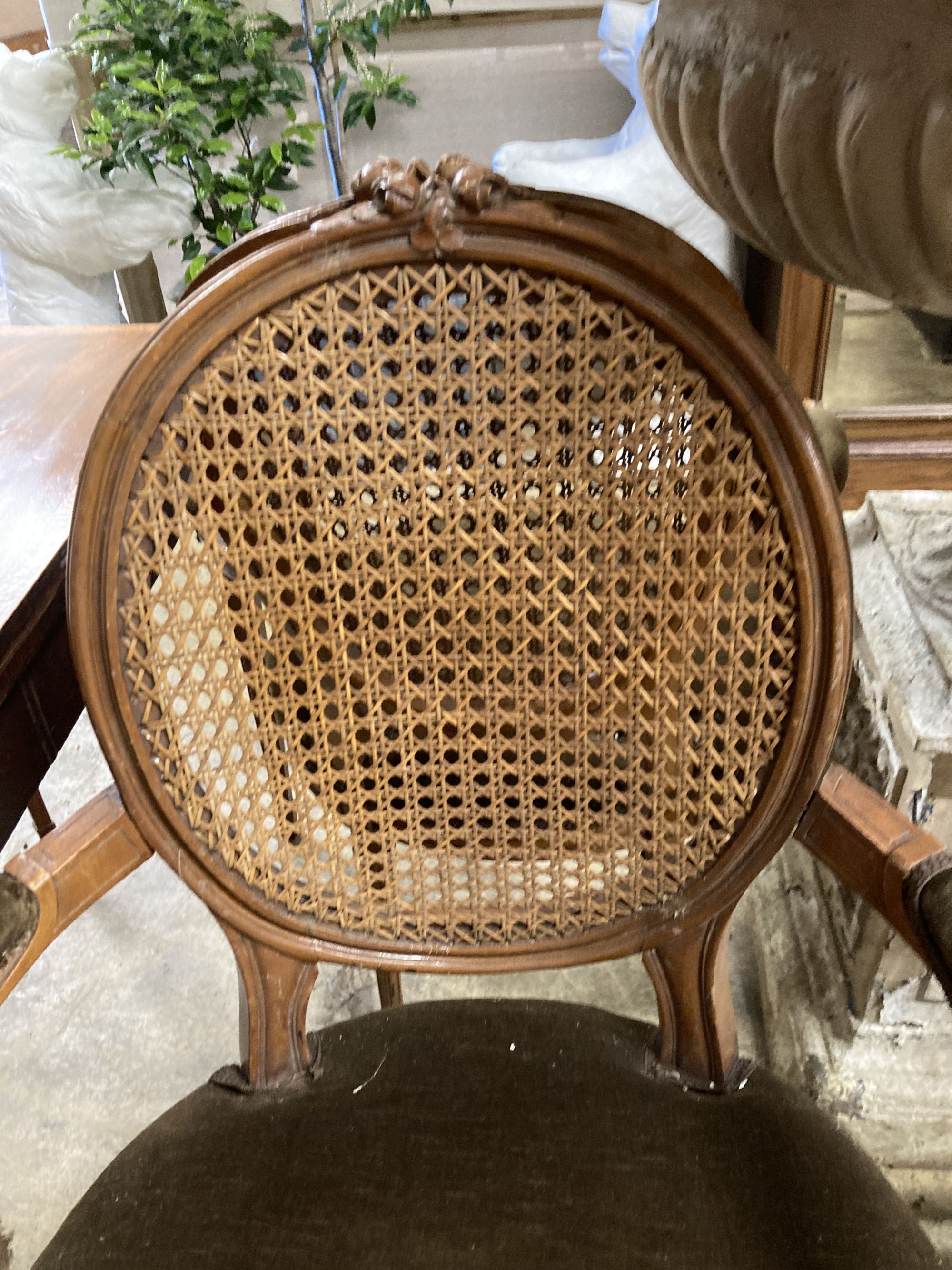 A pair of Louis XVI style caned back fauteuils